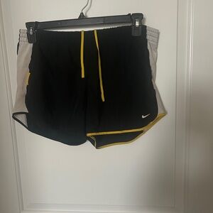 Nike Women's Black and White Athletic Shorts with Yellow Accents